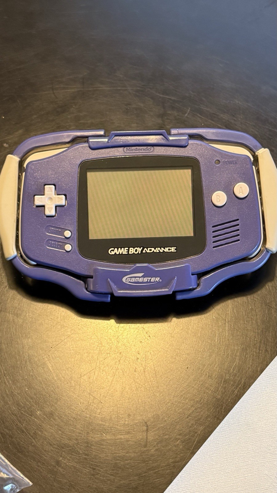 Nintendo Game Boy Advance Indigo w/ gamester light and 4 game cartridges
