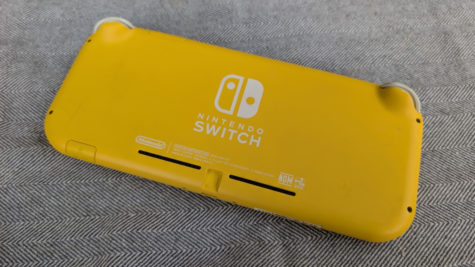 Broken Nintendo Switch Lite Yellow Handheld Console