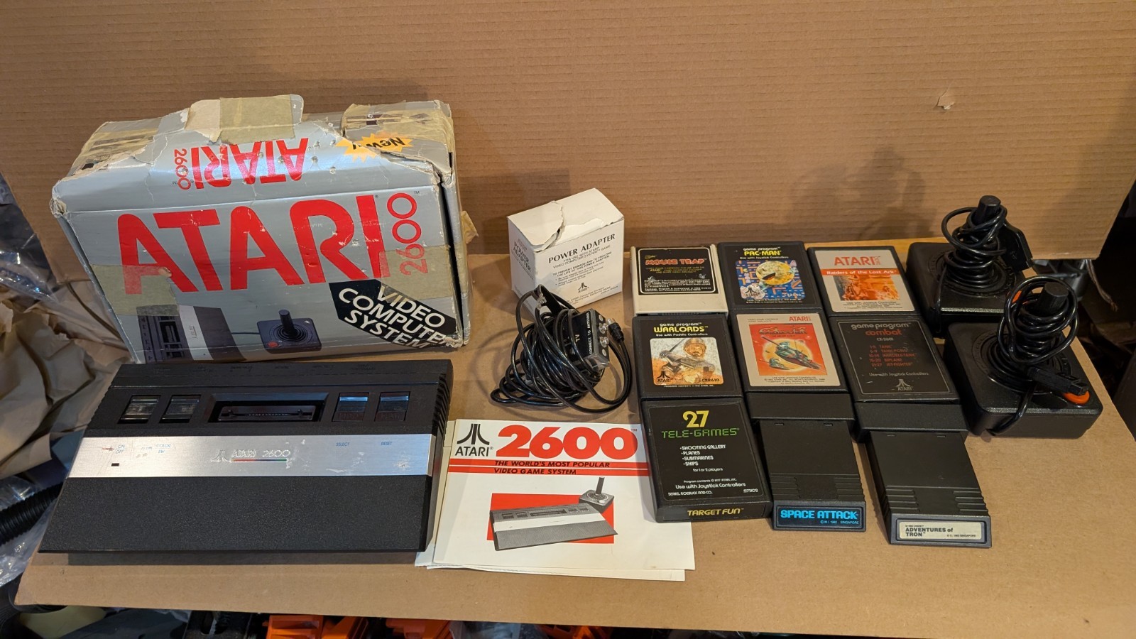 Atari 2600 1984 edition w games , 2 joystick controllers, power pack, TV adapter