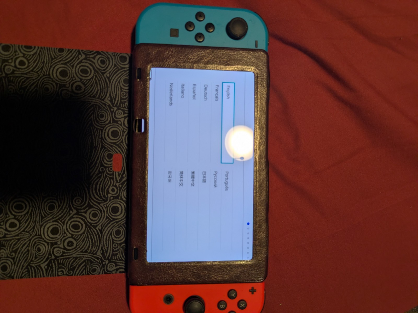 Nintendo Switch OLED Console with Red Blue Joy-Cons and Zelda Carry Case