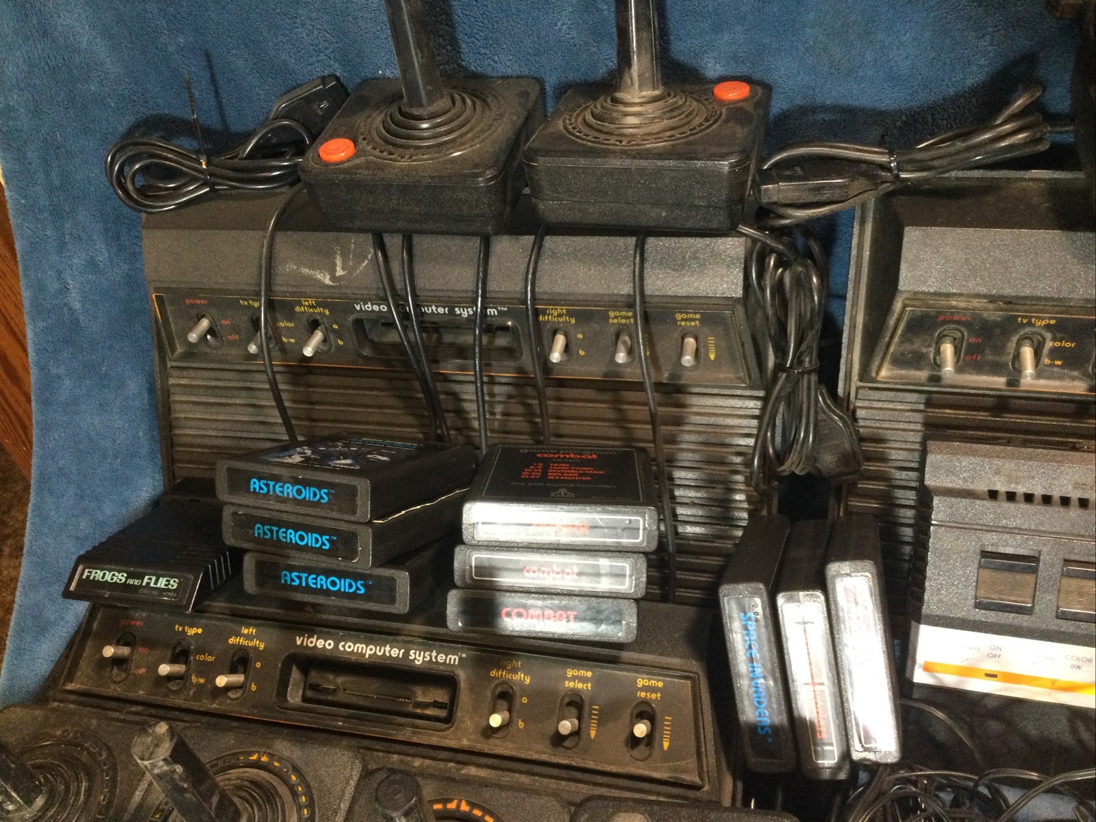 LOT(4) ATARI 2600 CONSOLES (42)GAMES (21)CONTROLLERS (4)AC ADAPTERS UNTESTED!!