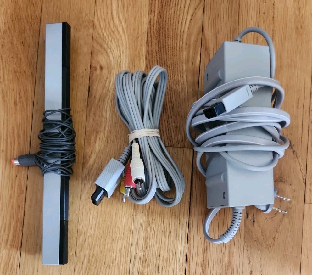 Nintendo Wii Console Bundle: 2 Remotes 2 Nunchucks, All Cords, 4 Games & Stand