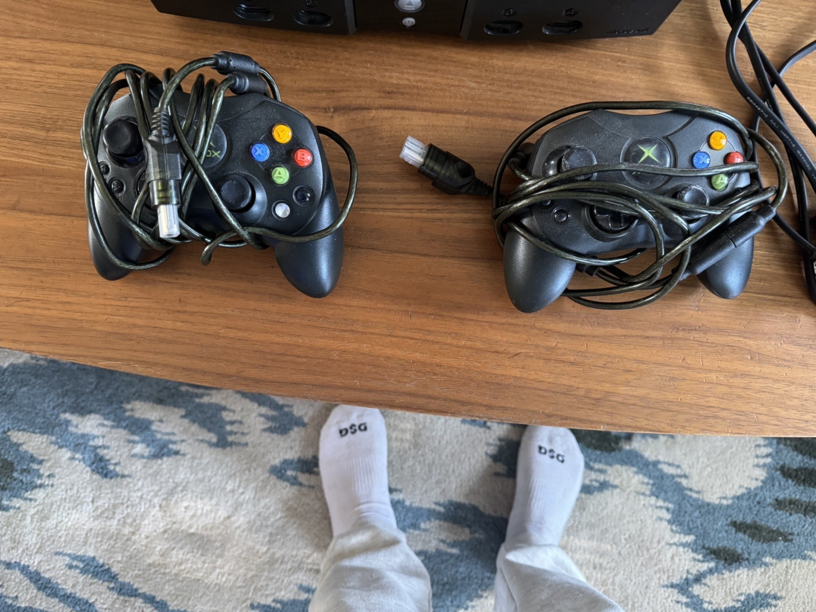 black xbox original consol works connects to tv controllers works fine and cords