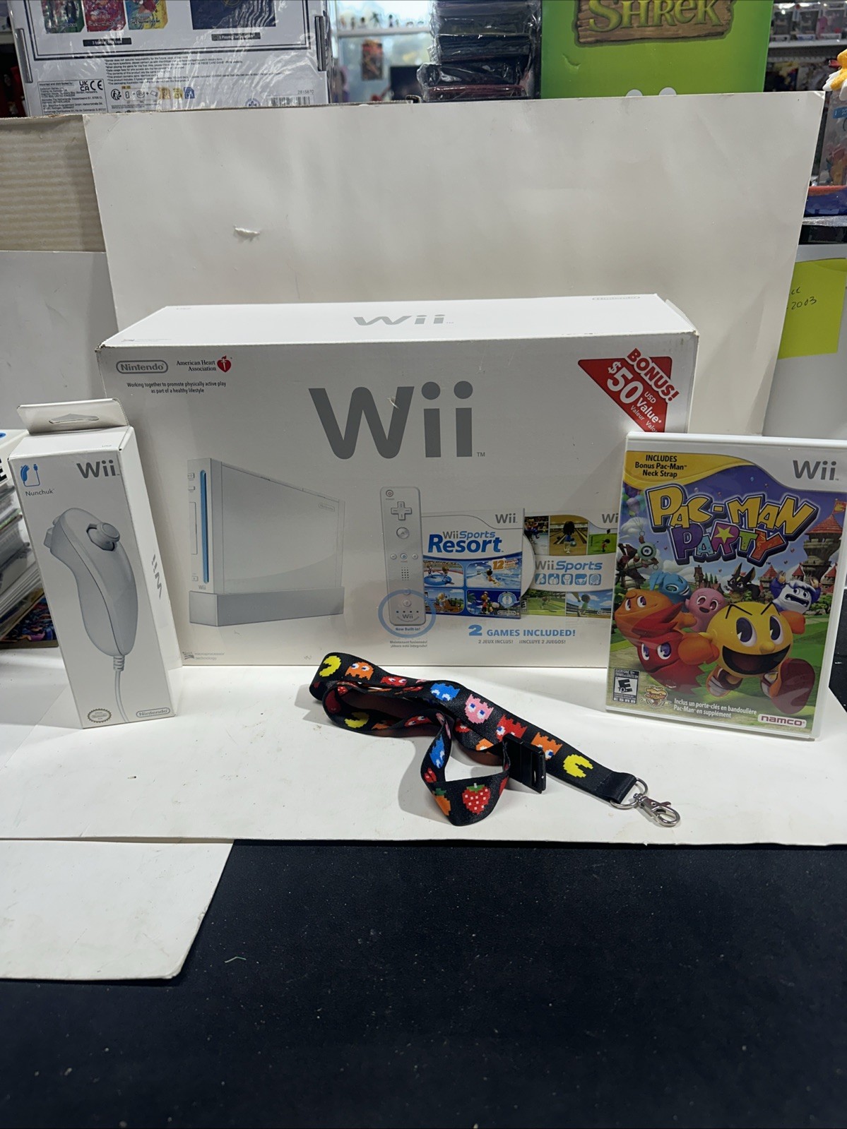 Nintendo Wii White w/ Wii Sports & Resort – A.H.A. + Nunchuk + Pac-Man Party +++