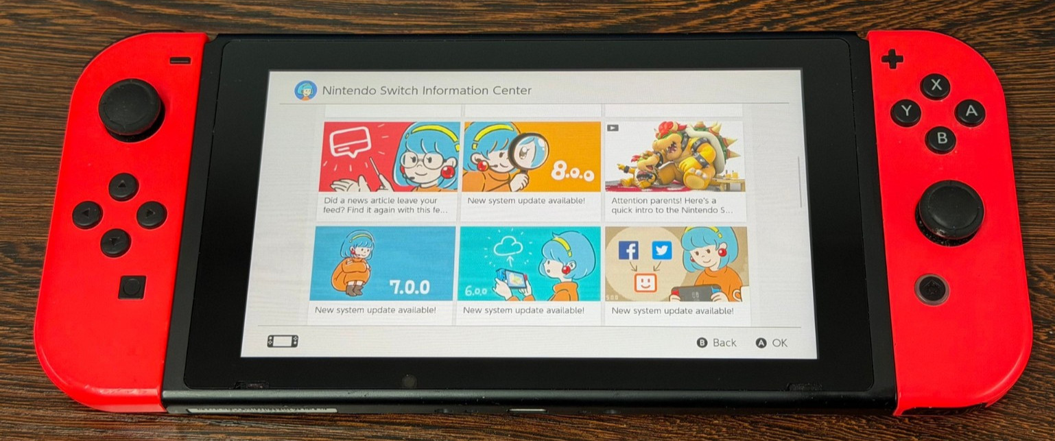 Nintendo Switch Handheld Console – Neon Red JoyCons – Excellent Condition