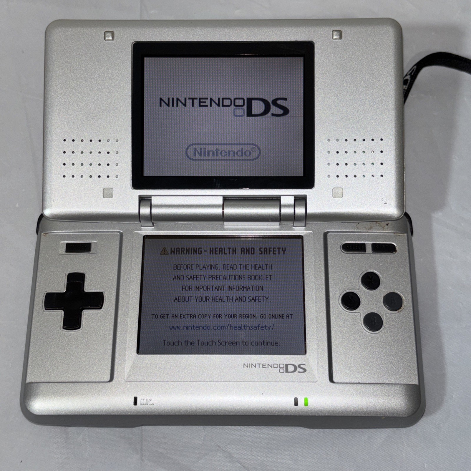 Nintendo DS Silver Handheld System with Wrist Strap + 6 Games Tested and Working