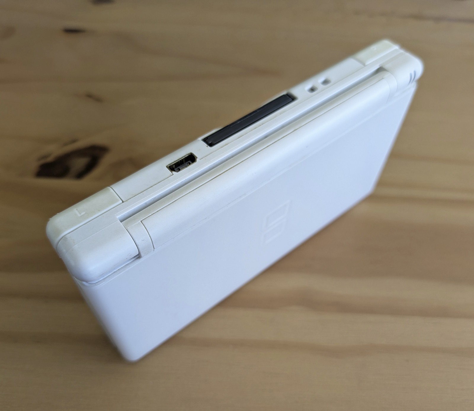 Nintendo DS Lite White + Carrying Case + OEM AC Adaptor + New Super Mario Bros.