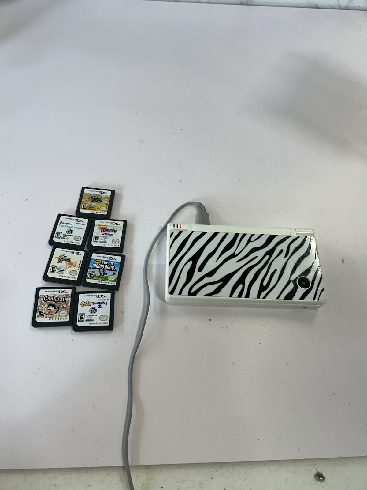 Nintendo DSi White With Print Cover Handheld System with 7 Games
