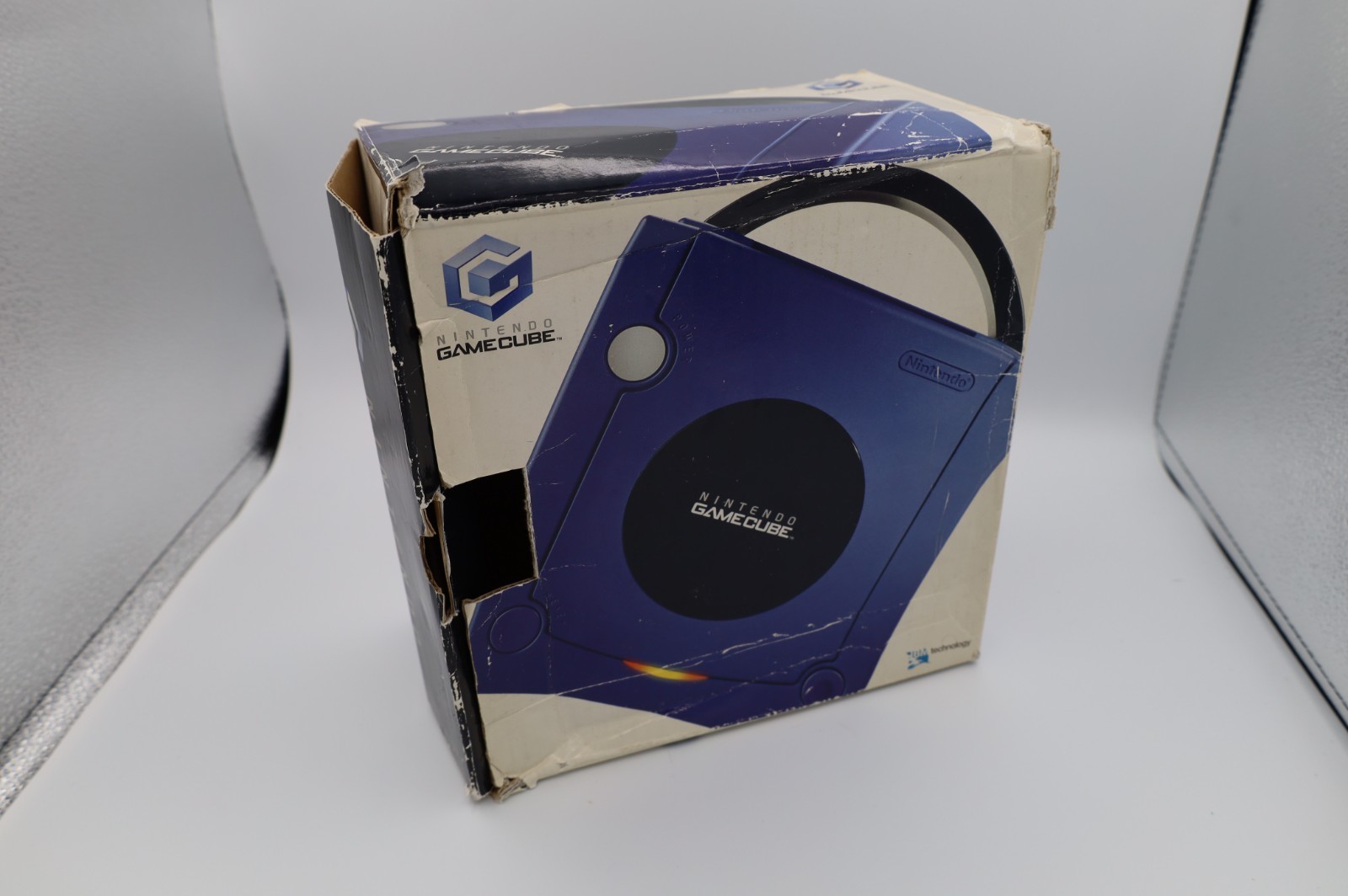 Nintendo GameCube Indigo console with original box, power adapter, and AV cable