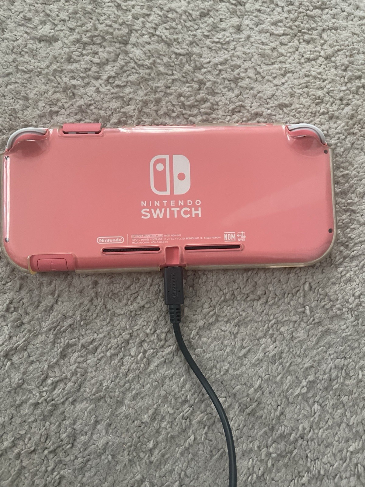 Coral Nintendo Switch Lite. Case, game and charger included.