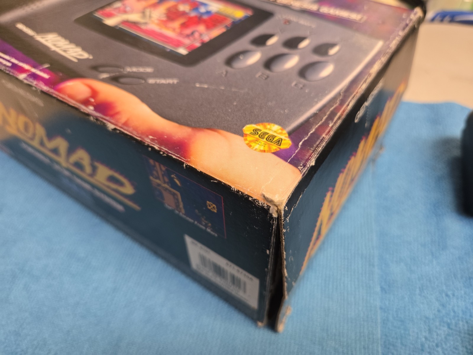 Sega Nomad Console. With Box (no inserts). A/C adaptor. Battery holder missing..