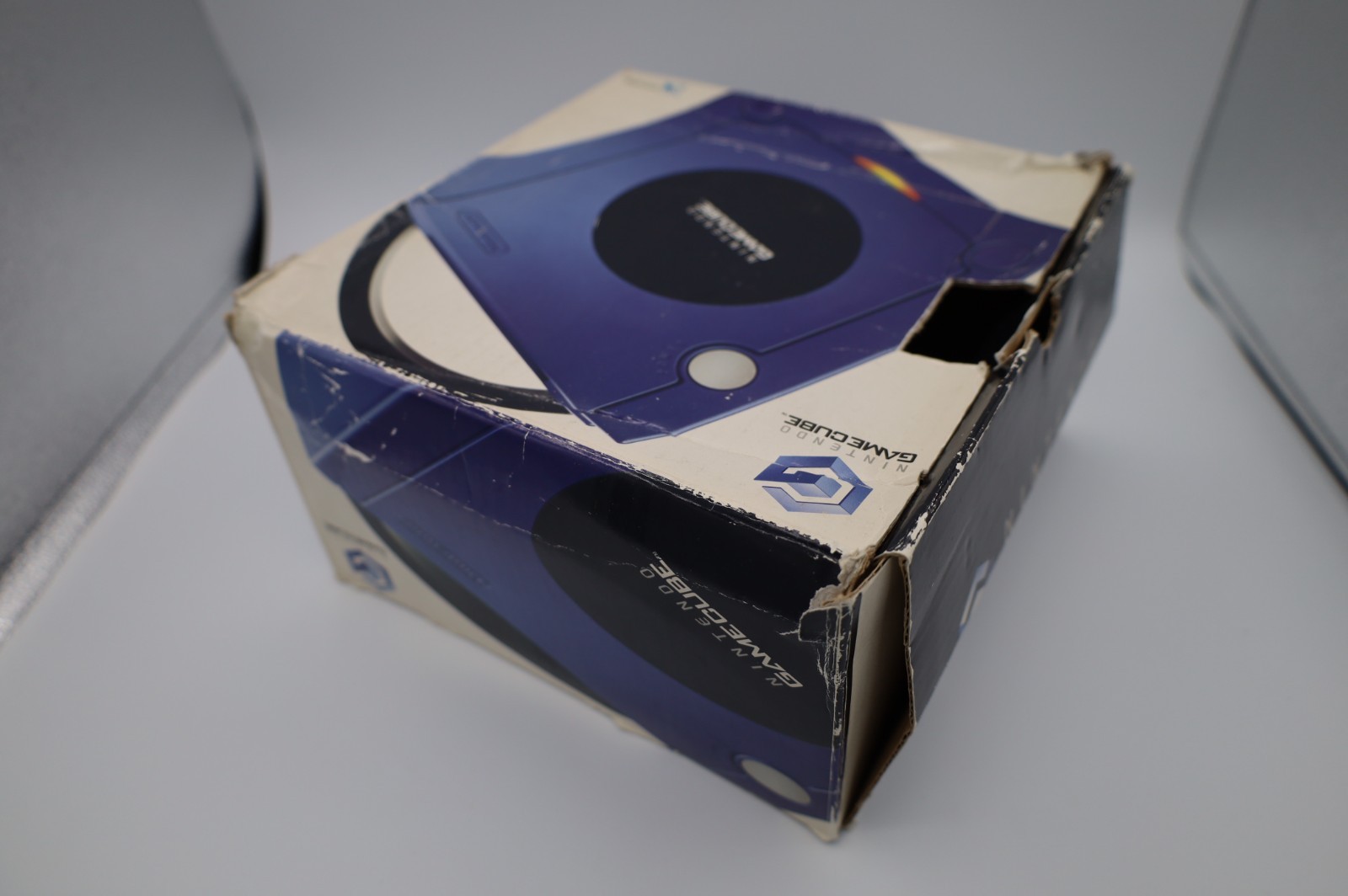 Nintendo GameCube Indigo console with original box, power adapter, and AV cable