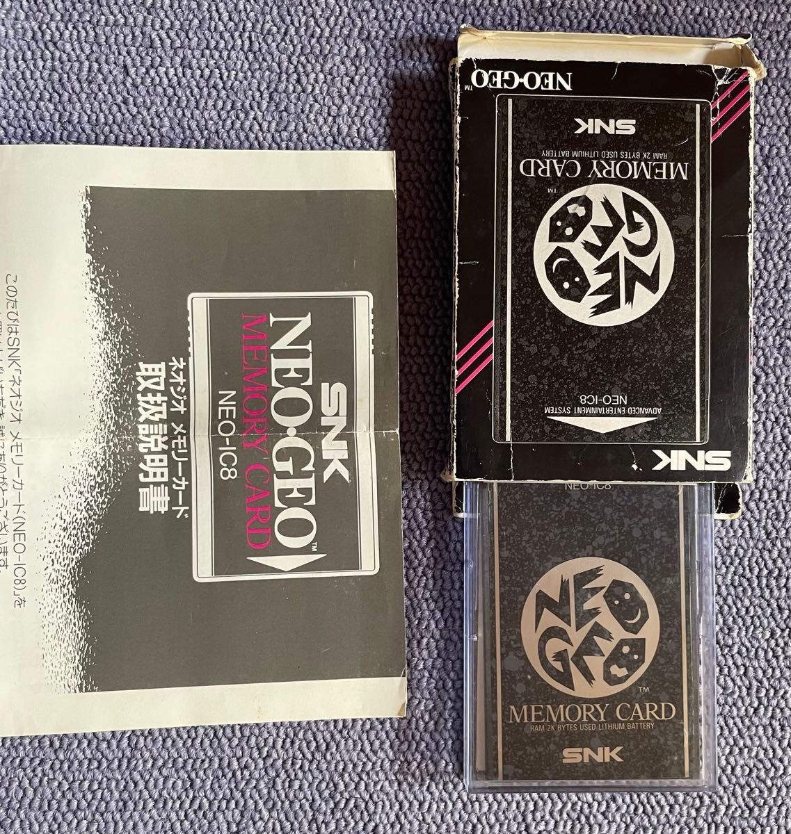 Neo Geo console, 2 controllers, 5 ROM cartridges, and 1 memory card.Tested