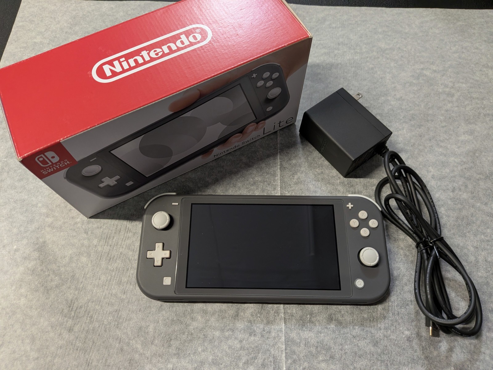 Nintendo Switch Lite Gray Handheld System with Original Box and Charger – Used