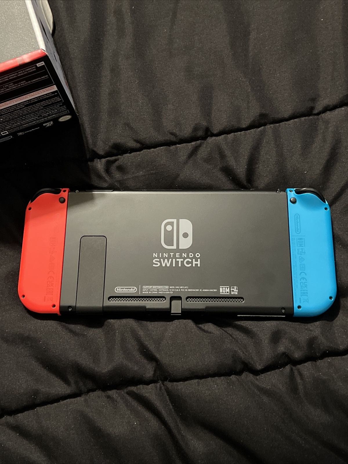Nintendo Switch Blue and Red Joy-Con Controllers and Mario Kart 8