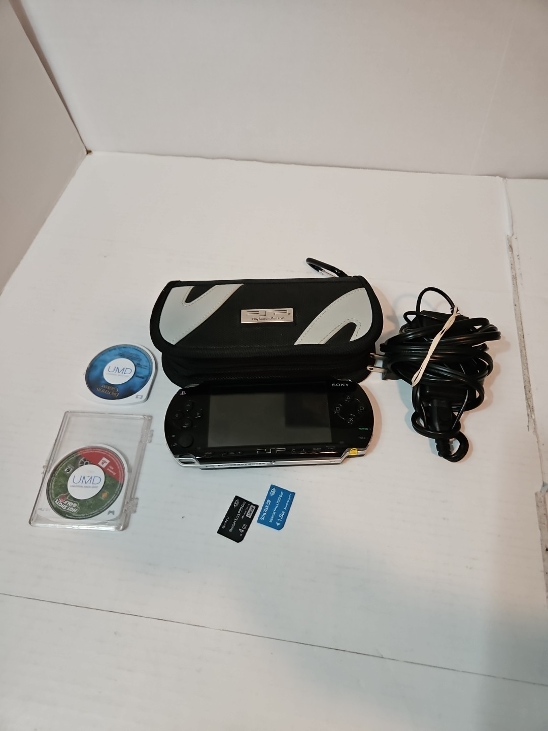 Sony PlayStation PSP-1001 Black Console Cards Charge Case 2 Games 1 Movie READ