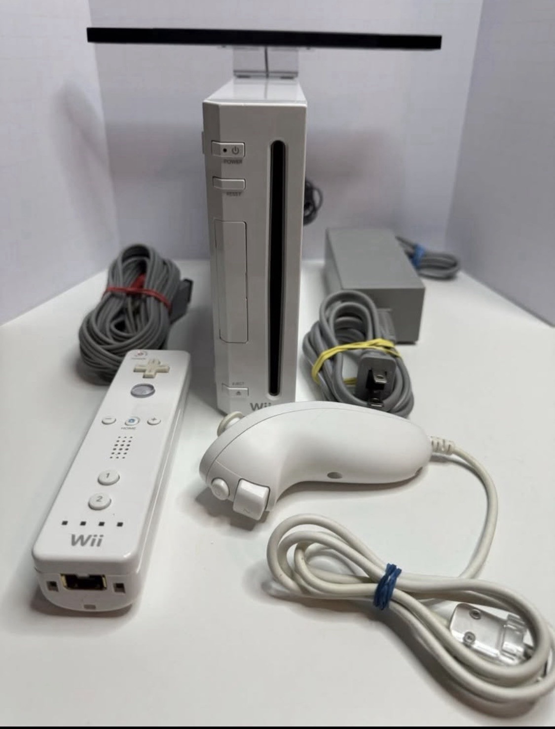 Nintendo Wii Console with Nun chuck and Remote with all cords – Tested A+