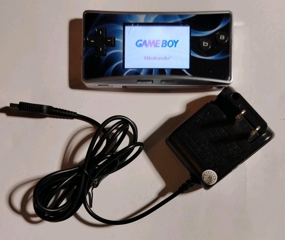 Nintendo Game Boy Micro GBA (Working) with Cracked Faceplate & 3rd-Party Charger