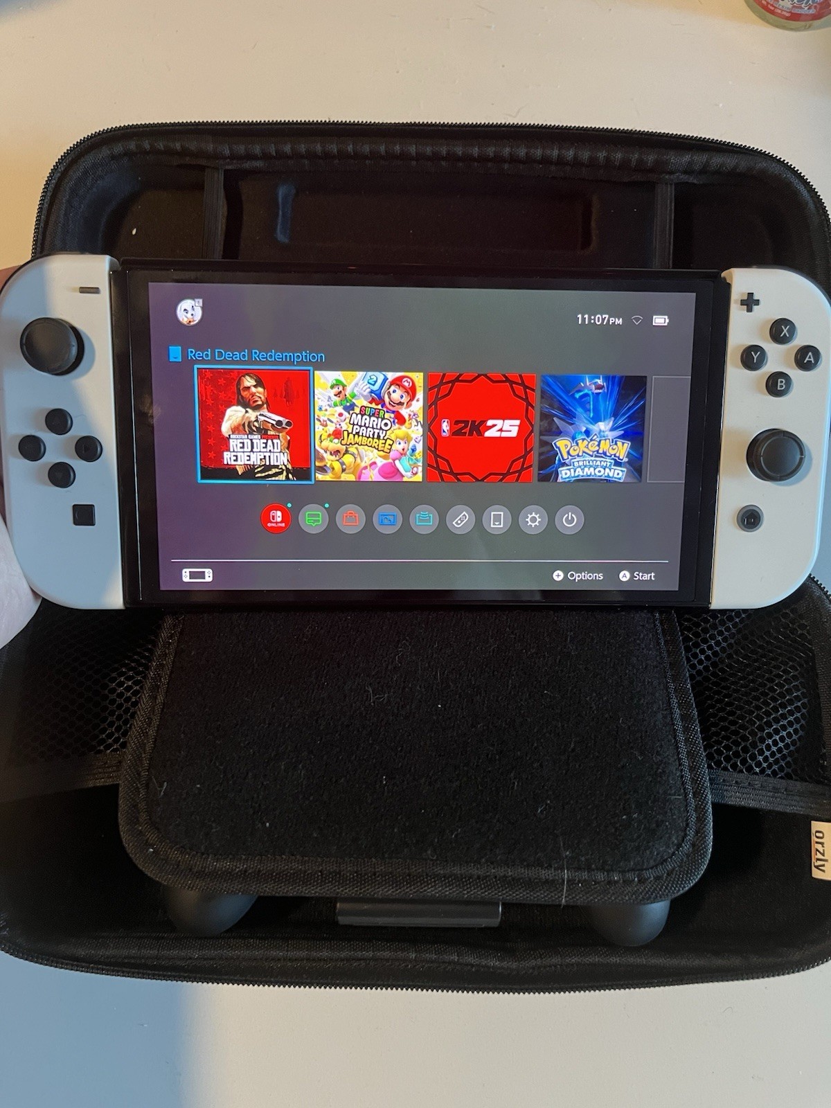 Nintendo Switch OLED Model 64GB 1080p White Joy-Cons w/ Black Carry Case