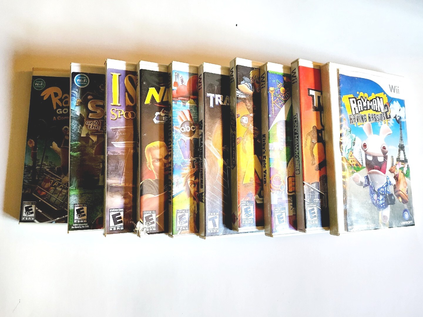 Nintendo Wii Black, 2 Wii Remote Plus, Charger Base With Assorted Games As Seen