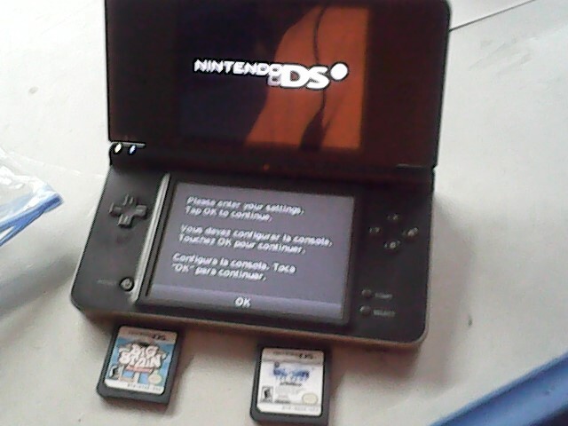 Nintendo DSi XL Bronze Handheld System – includes big brain academy and wipeout