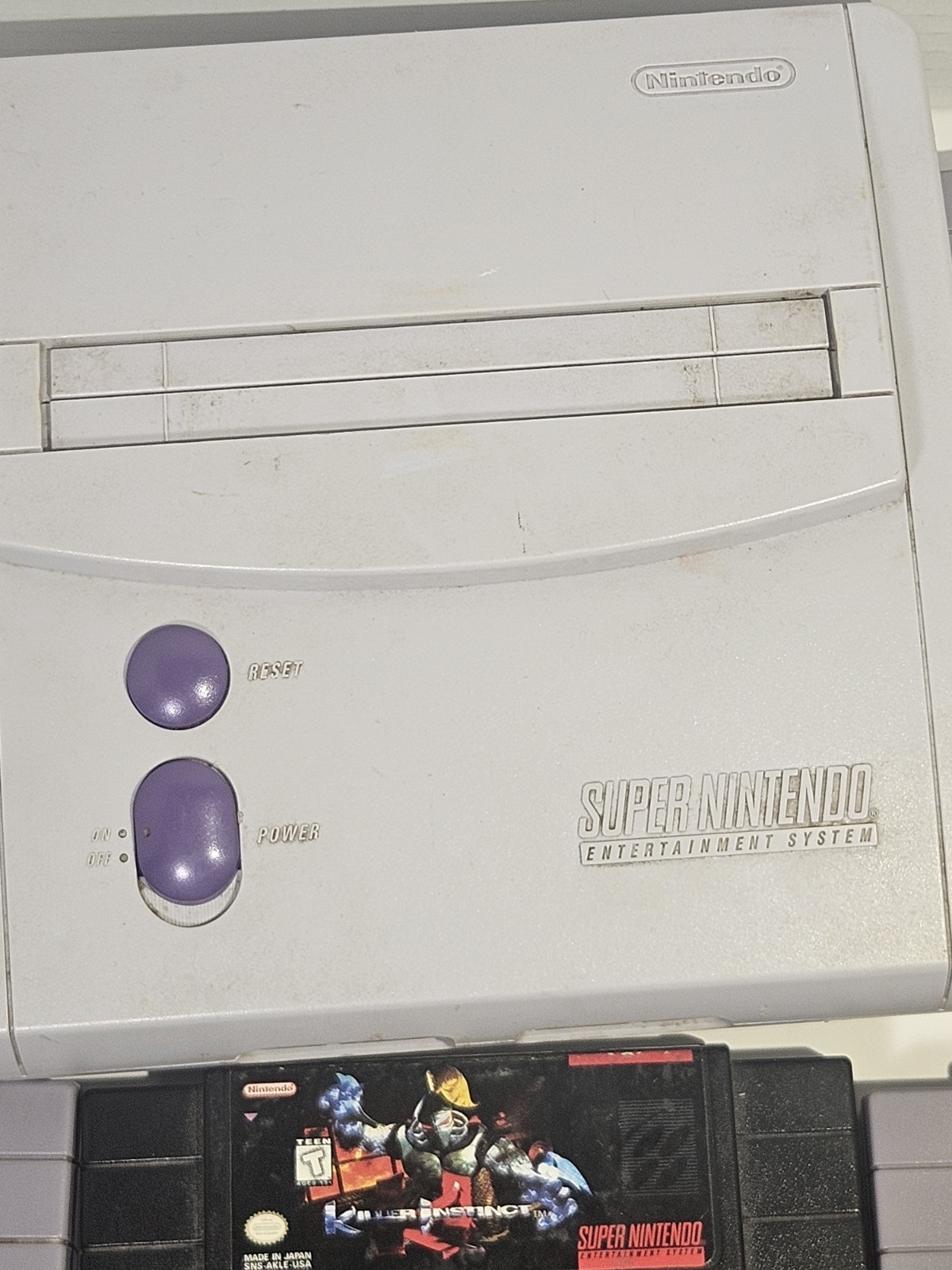 Super Nintendo SNES JR Console with 8 games, cords, and 1 controller