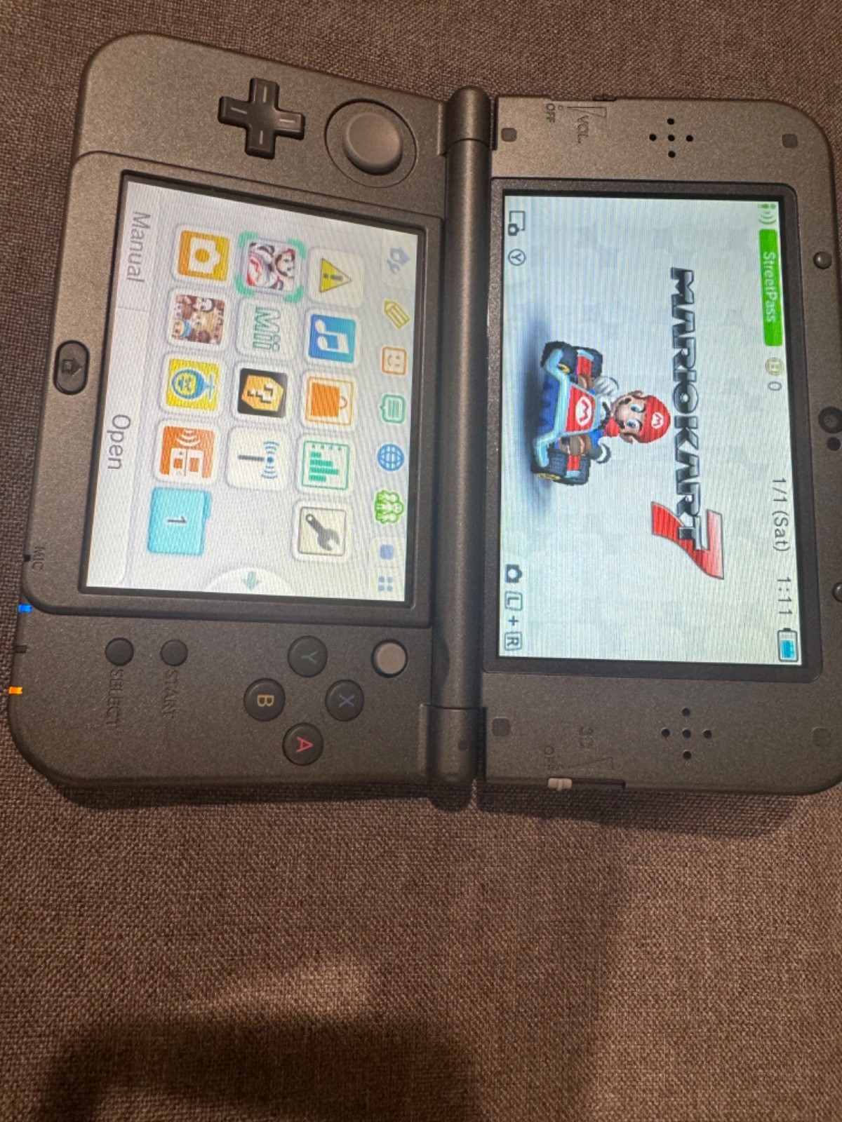 Nintendo 3DS XL Metallic Black with charger and 5 games great condition