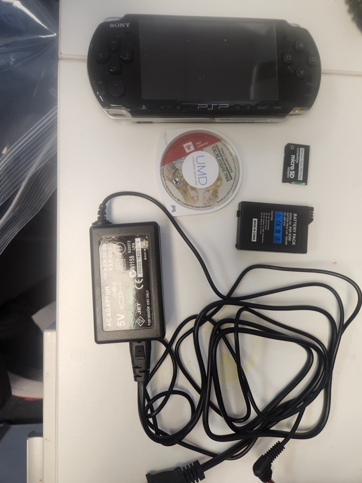Sony PSP-3000 64MB Black Handheld System w/ Tactics Ogre: Let us Cling Together