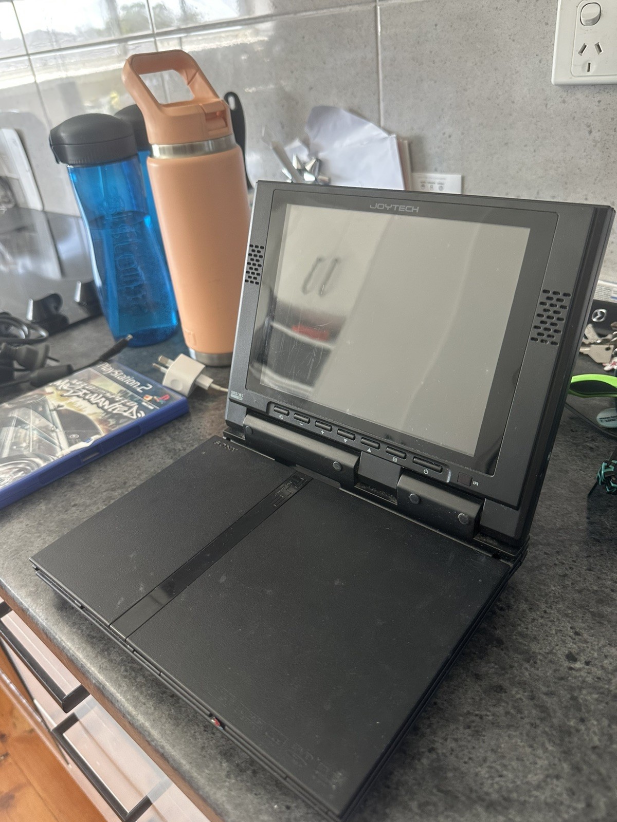 PlayStation 2 Slim Console black with joyteck 8inch screen and nfs most wanted