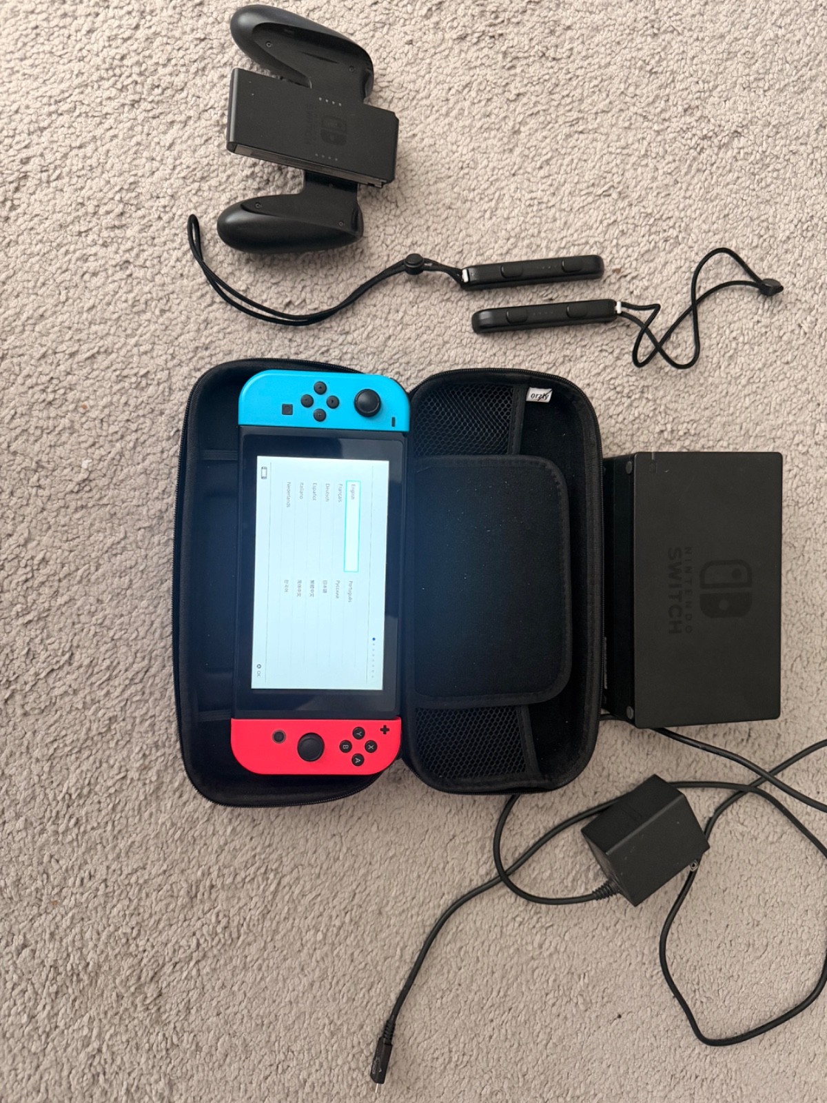 Used Nintendo Switch 32gb Red/Neon Blue with case and grips