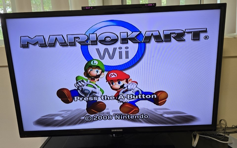 Nintendo Wii MINI Red RVL-201 Console with cables, controller, and Mario Kart