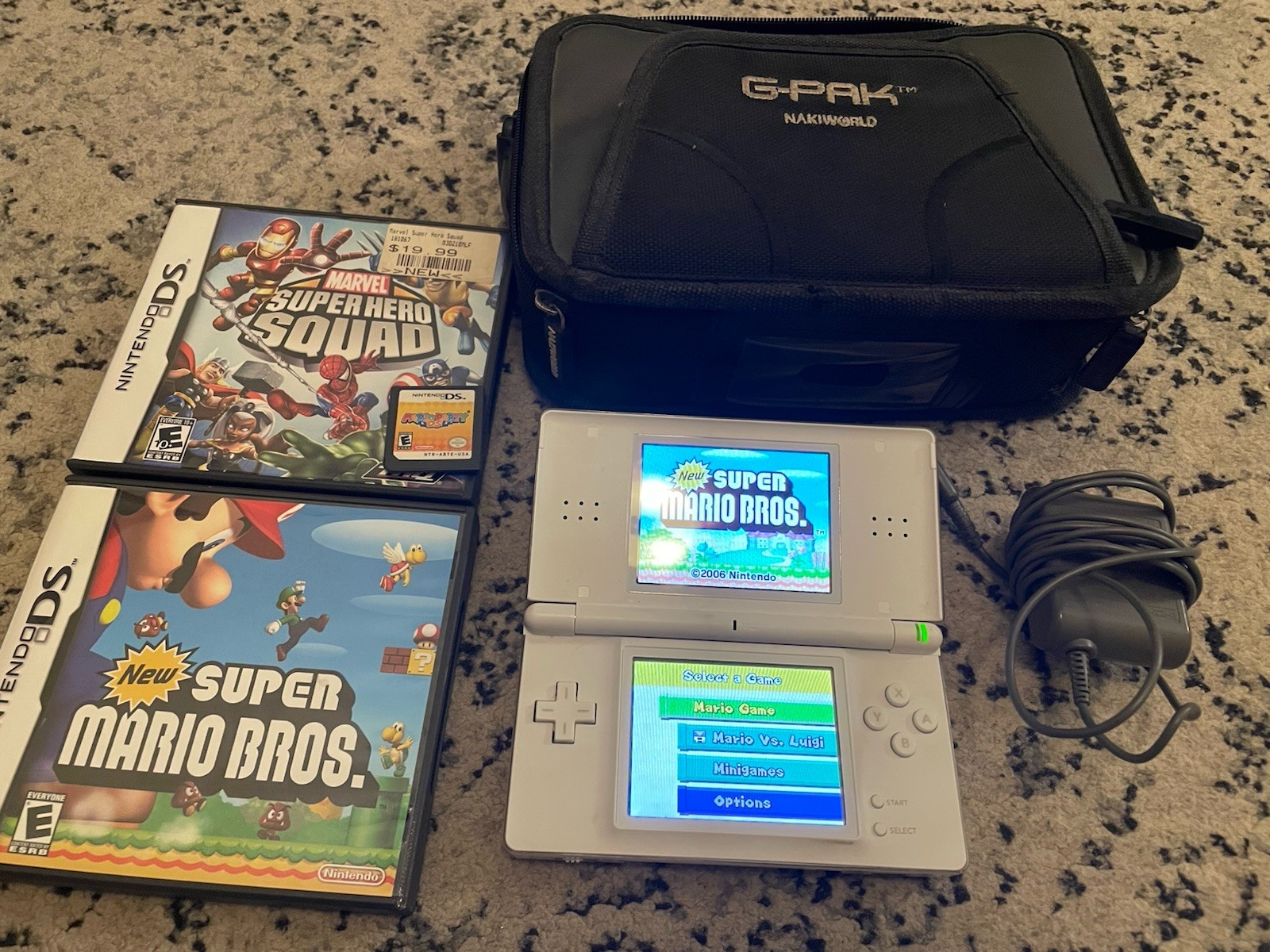 Nintendo DS Lite White Console Bundle 4 Games Mario Marvel Case Charger