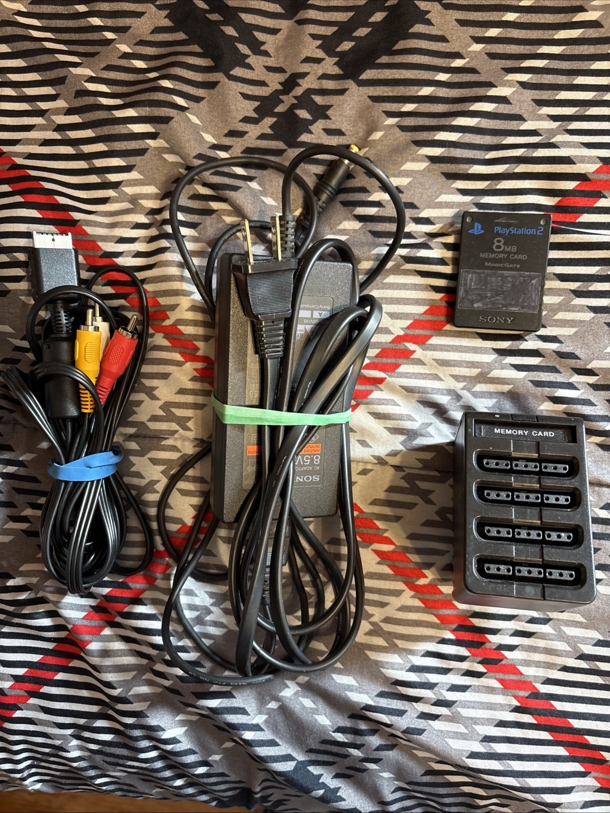 Sony PS2 Console, Controller, 4 Player Adaptor, Wires, 8mb Memory Card,& 7 Games