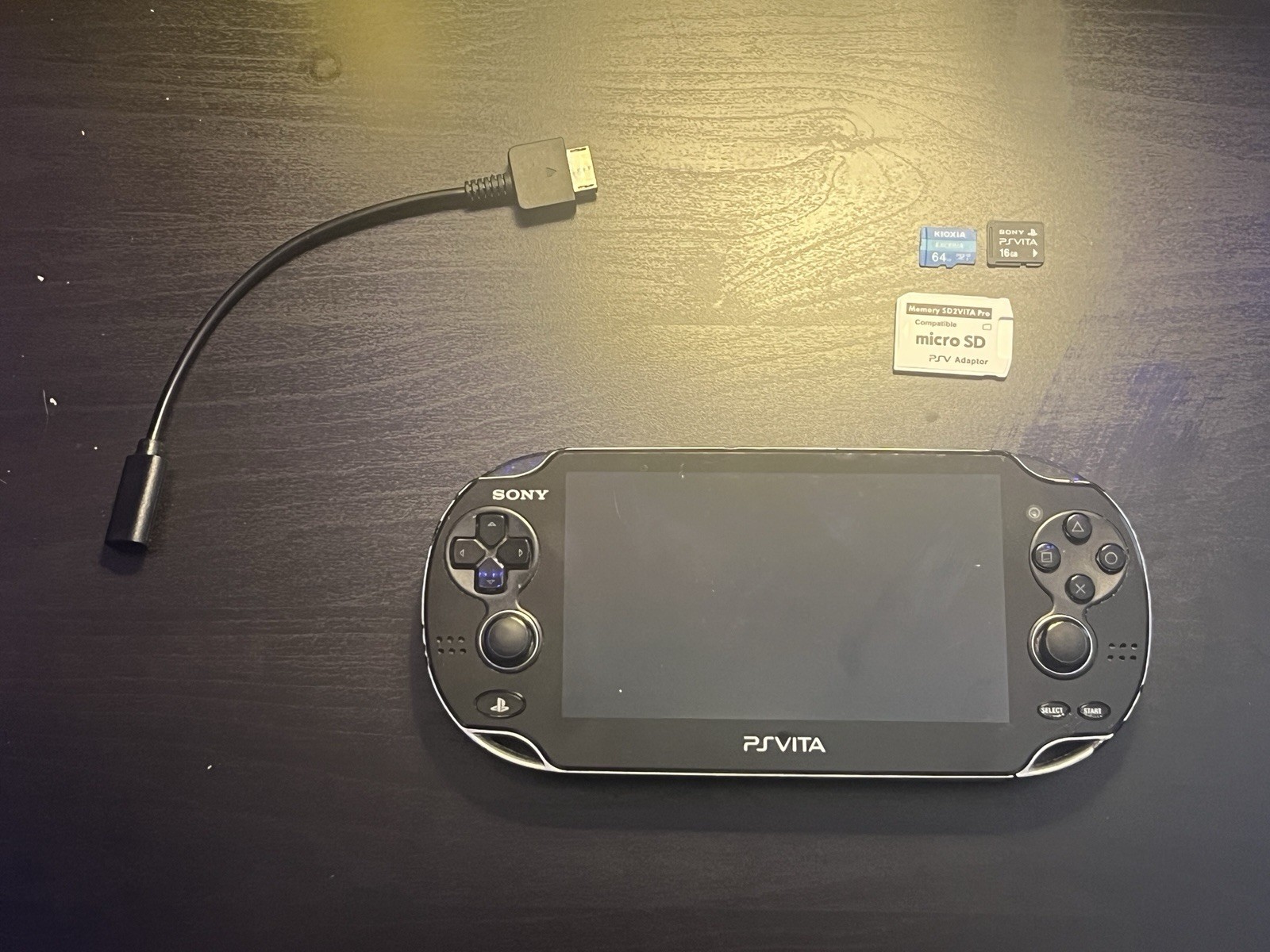 Sony PlayStation Vita 1000 + SD2vita + Charging Dongle + Memory Card + SD Card