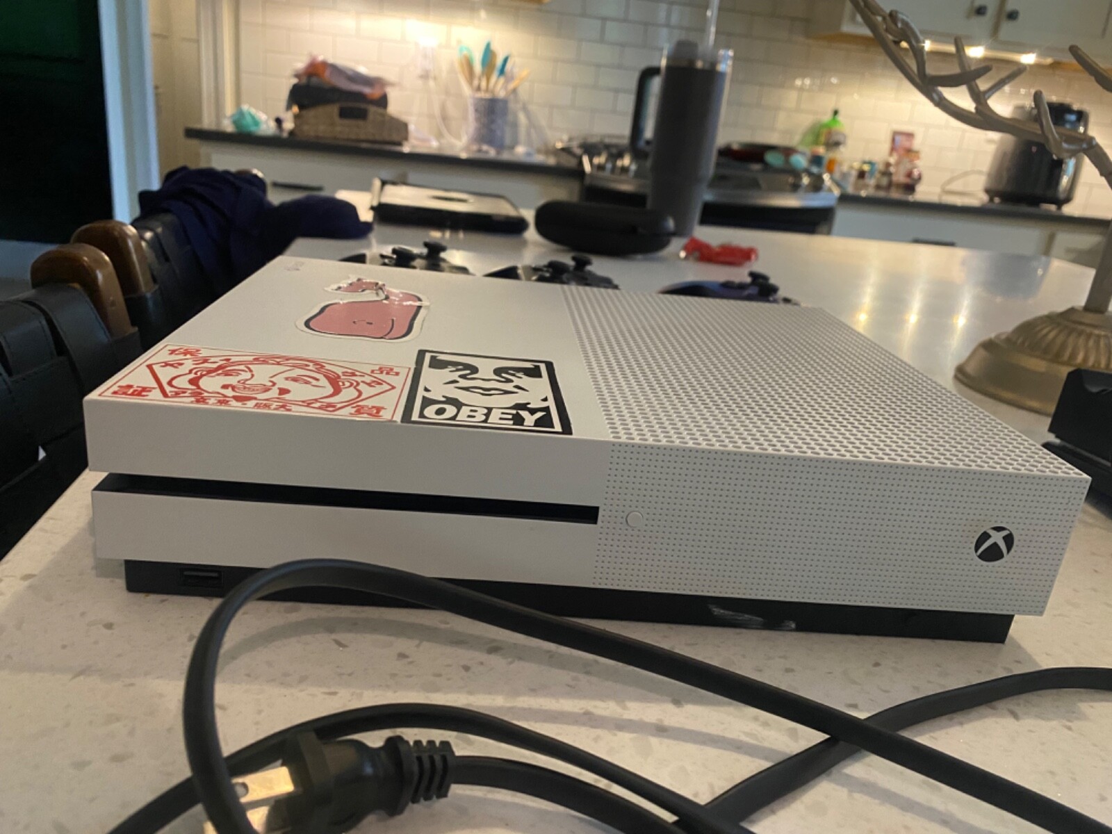 Xbox with custom controller and a Bluetooth headset with wireless charger