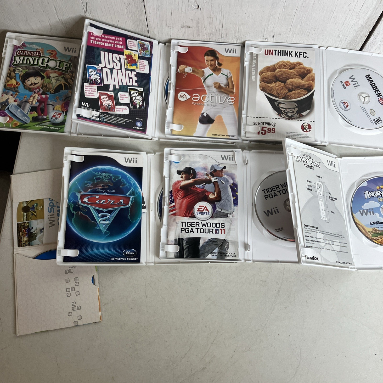 Nintendo Wii Bundle, 2 Controllers, 8 Games Wii Sports Cars 2 Angry Birds Golf