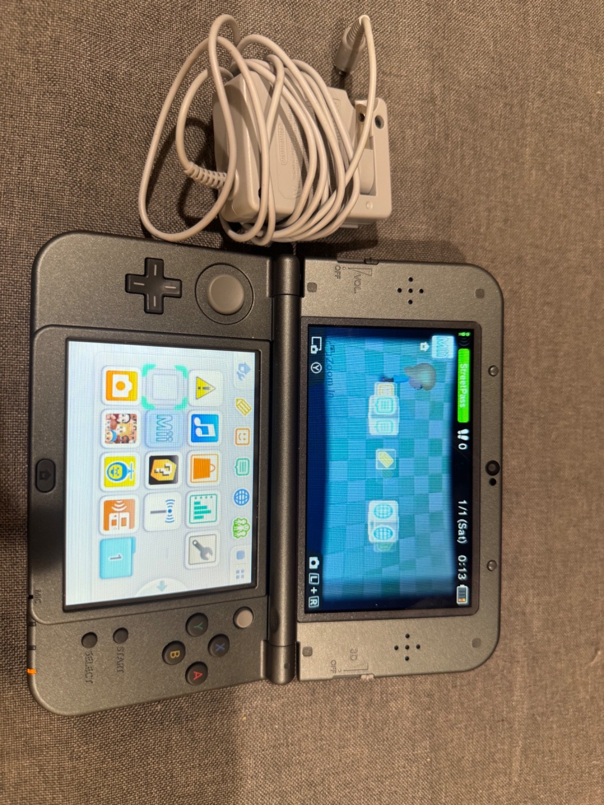 Nintendo 3DS XL Metallic Black with charger and 5 games great condition