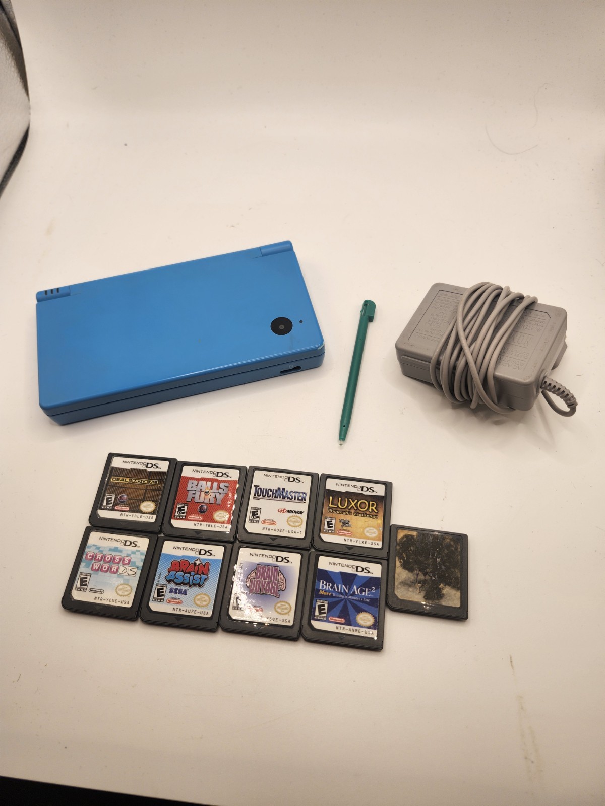 Nintendo DSi Blue Handheld Console w/ Stylus, Charger, & 9 Games
