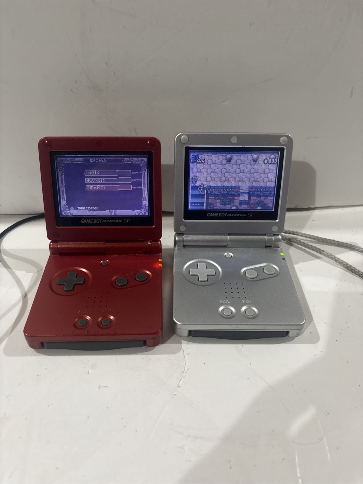 2- Nintendo Gameboy Advances SP Silver AGS 001 One Silver And One Red