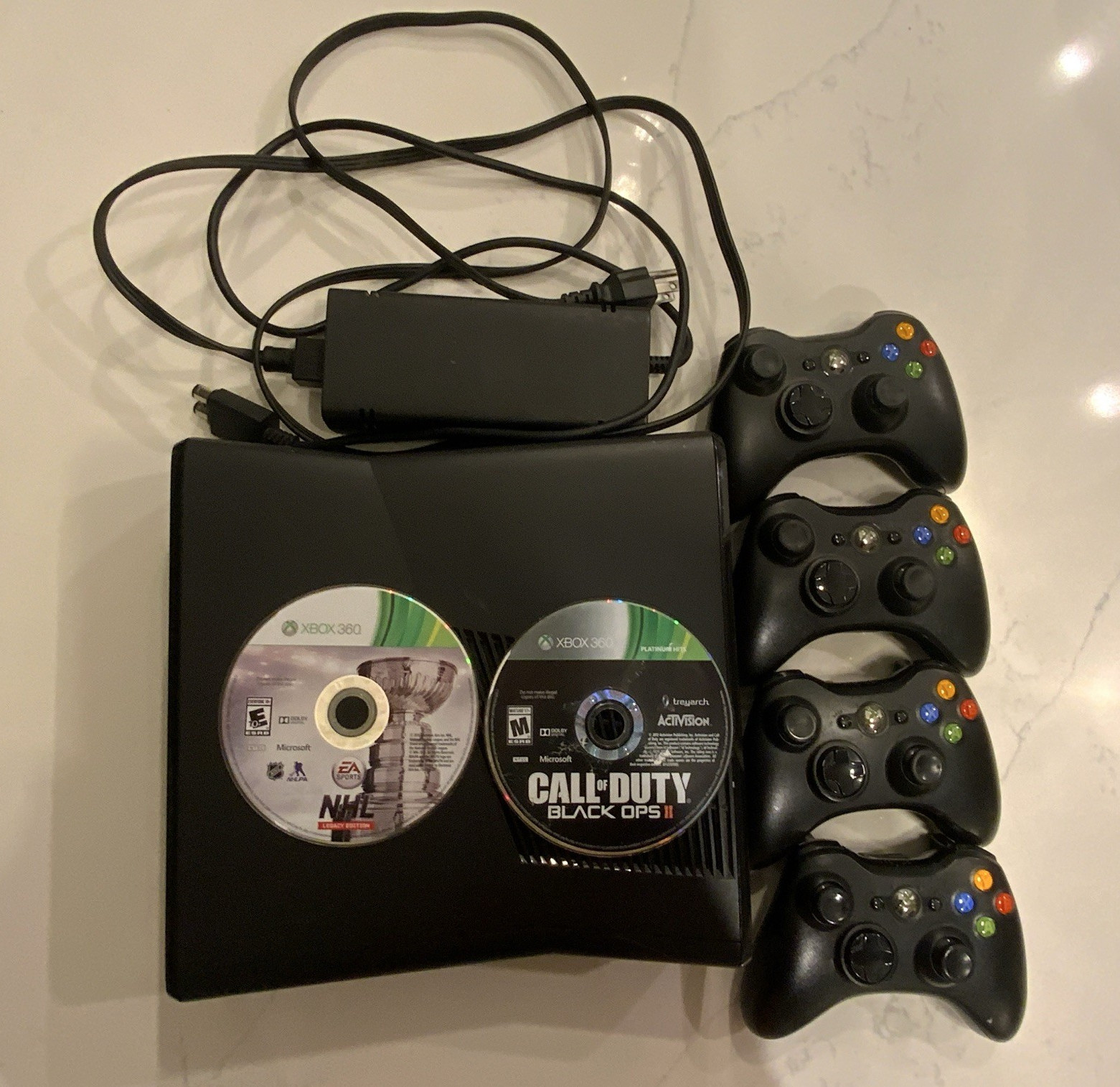 Microsoft Xbox 360 S Slim Black w/power cord, 4 Wireless Controllers + 2 Games