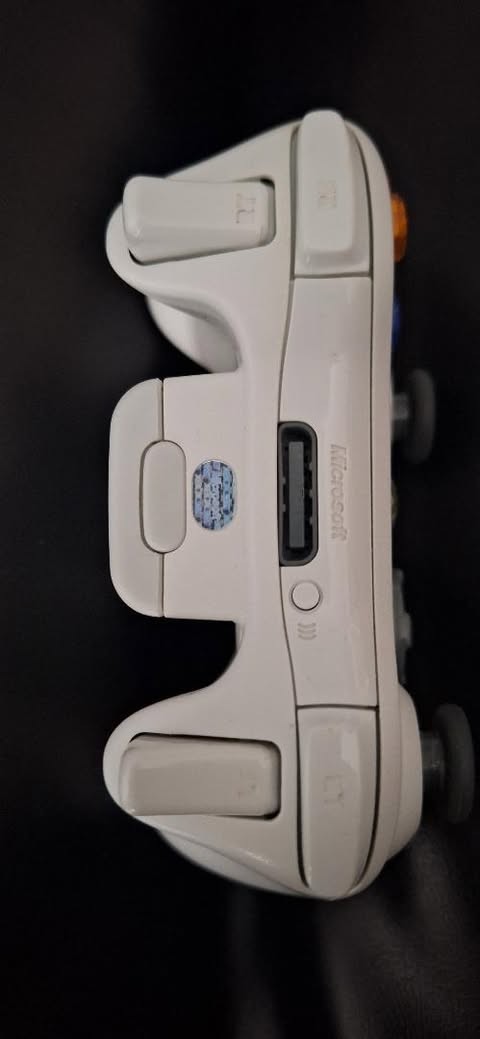 Black Microsoft Xbox 360 E Console With White Controller and AC Power Adapter