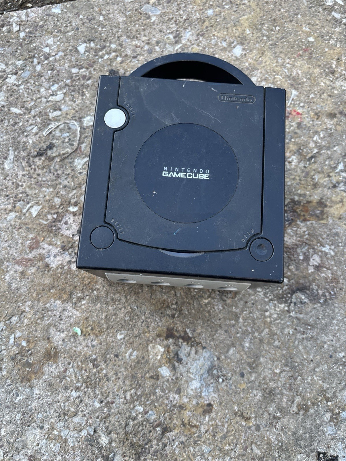 This item is a vintage Nintendo GameCube console in black.