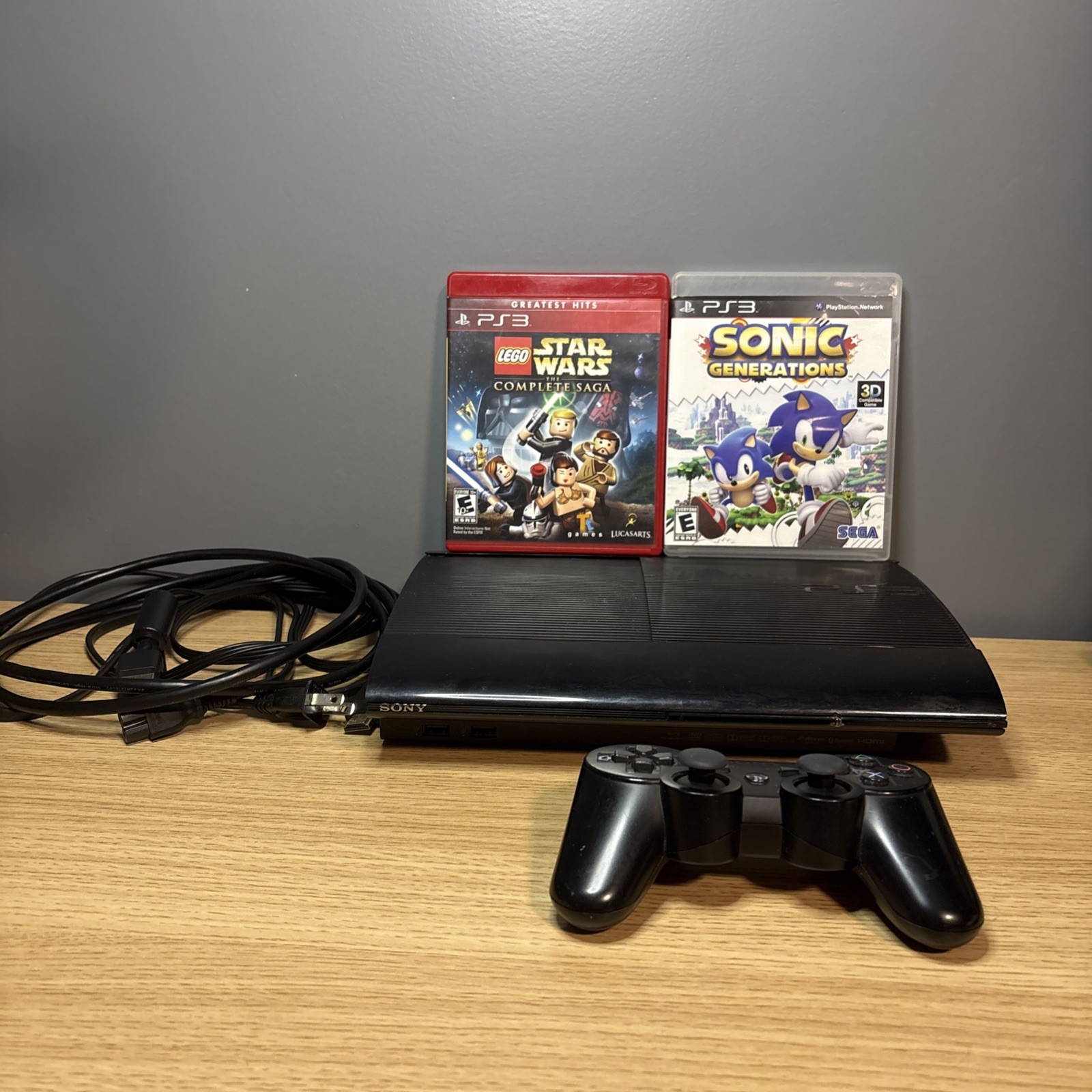 Sony PlayStation 3 Super Slim PS3 465GB Black Console with cords and two games