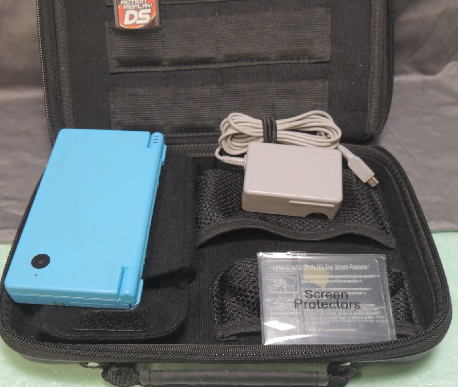 Nintendo DS Launch Edition Turquoise Blue plus Travel Case and extras Package