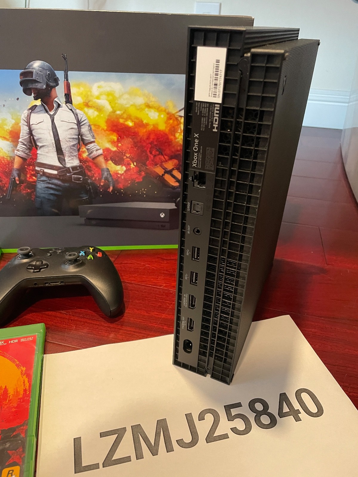Microsoft 1TB Xbox One X + 9 Games + Extra controller and charging stand