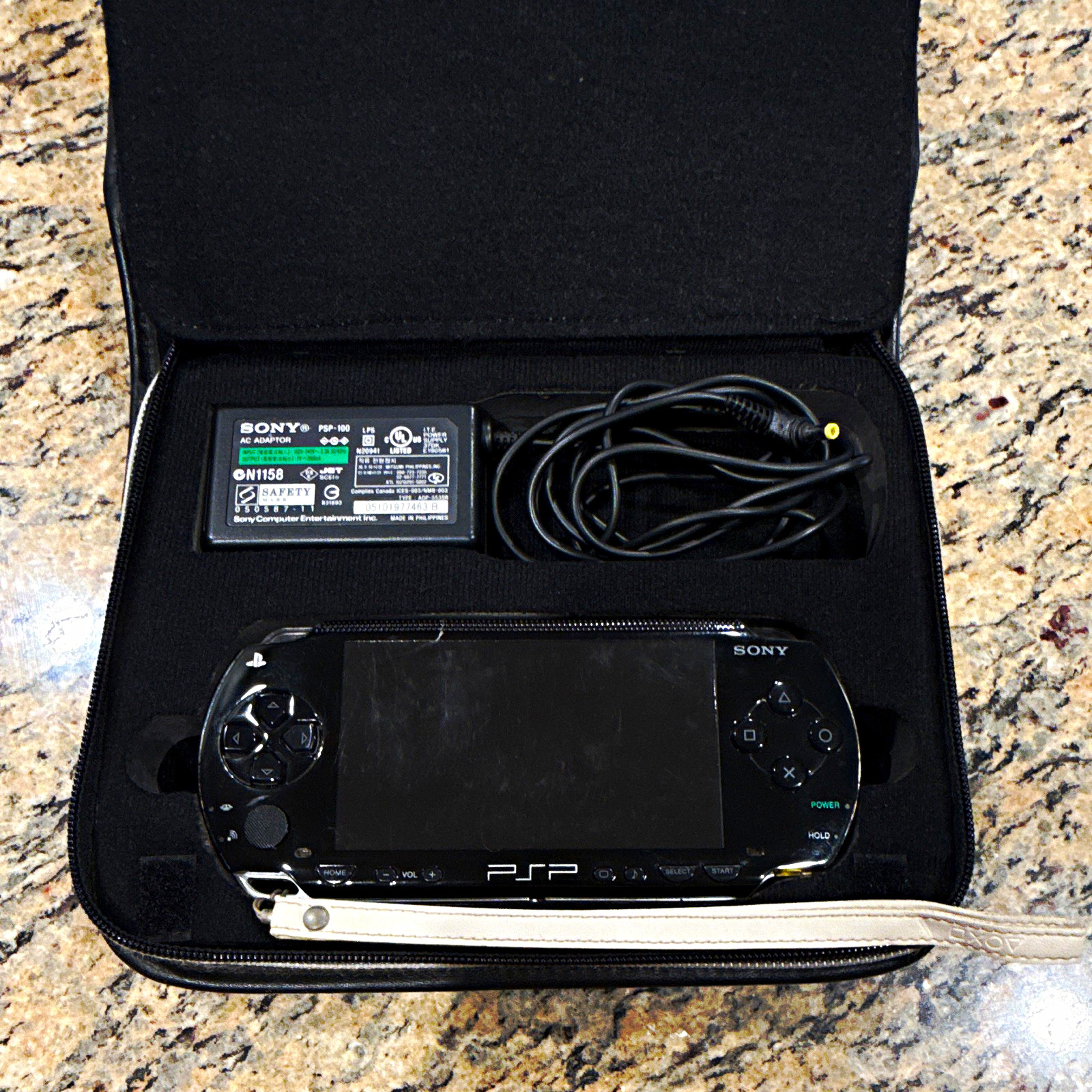 Sony PSP-1001 Bundle w/ AC Adapter, Case & UMD Games Battery Not Included