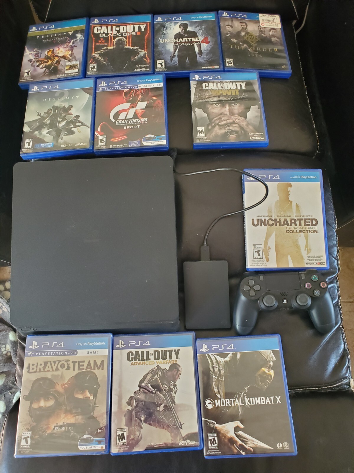 PS4, 2 controllers, 1T external hard drive, 12 games