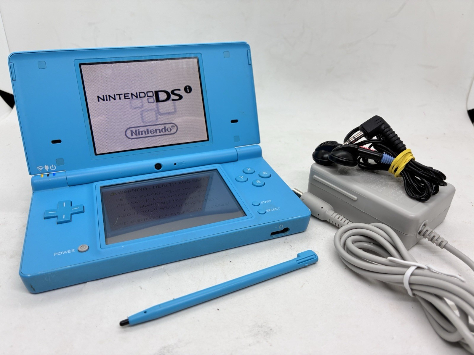 Nintendo DSi Blue Handheld Console (READ). Tested With Stylus, Earbuds Charger