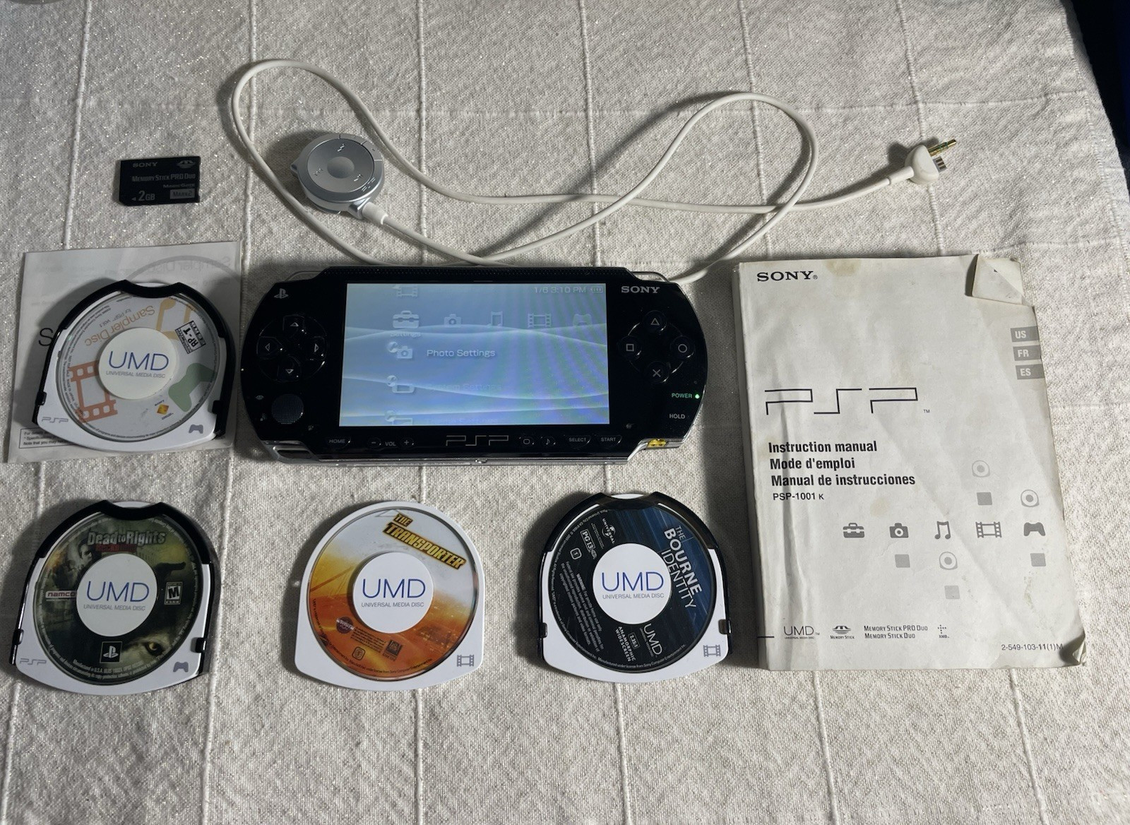 Sony PSP-1001 Black Console w/ 2GB Sony Storage Memory Card, 4 UMDs, Yes Charger