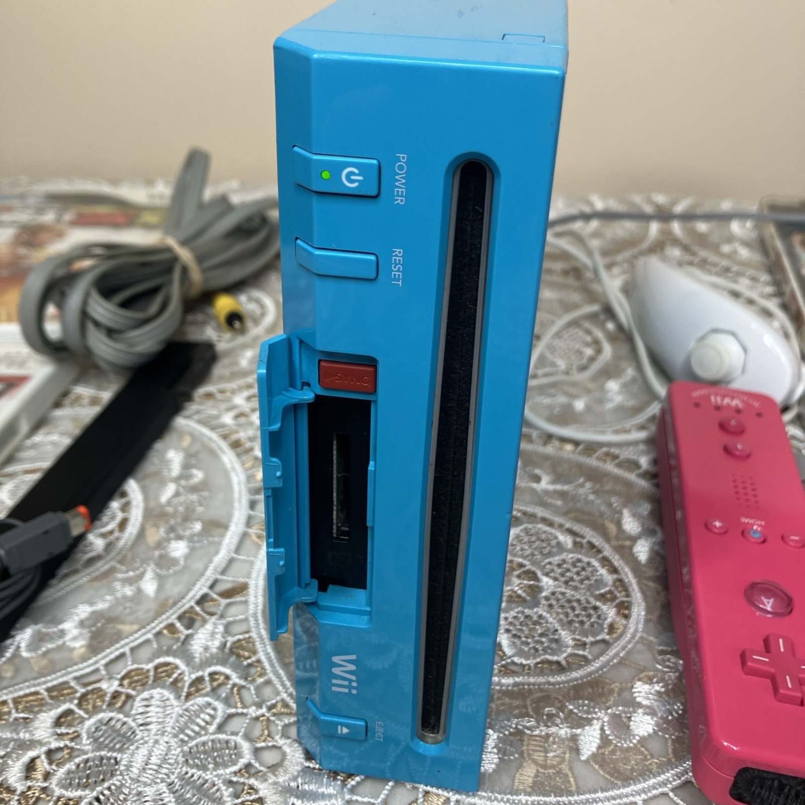 Nintendo Wii Bundle -Blue Console (Tested Works), Pink Remote, Nunchuck, 8 Games